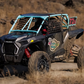 Polaris RZR Turbo S with WCI Off-Road race cage in the desert in motion
