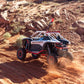 Off-road vehicle on a rocky desert trail with Segway branding, with WCI Off-road segway super villain roll cage
